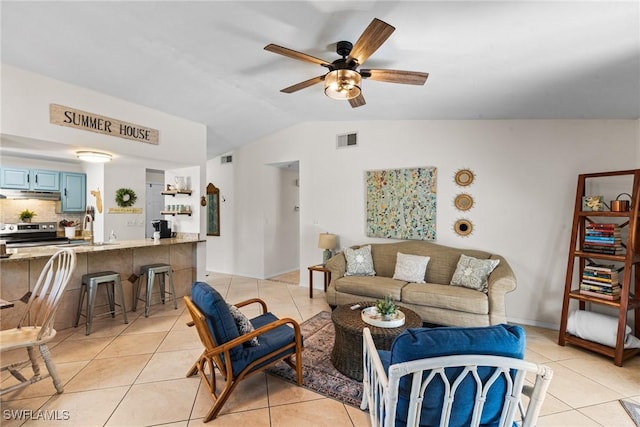 living room featuring ceiling fan, lofted ceiling, sink, and light tile patterned floors