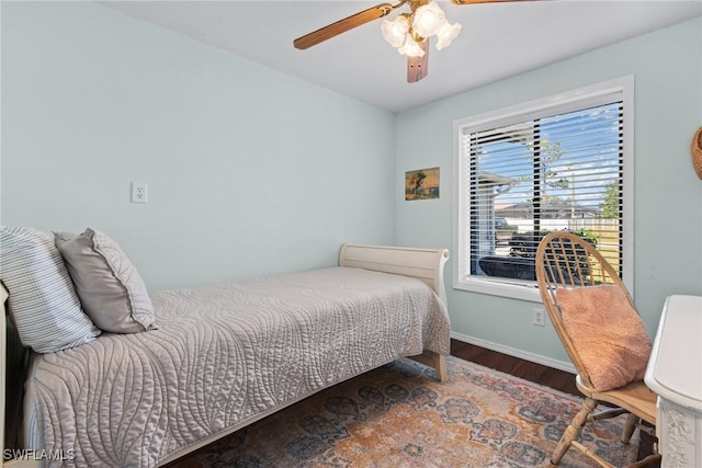 bedroom featuring ceiling fan and dark wood-type flooring