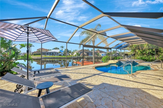 view of pool with a water view, a lanai, and a patio area