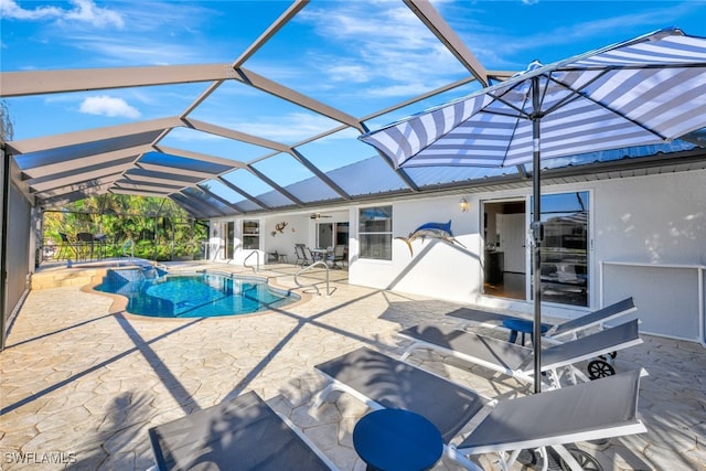 view of swimming pool with a patio and glass enclosure