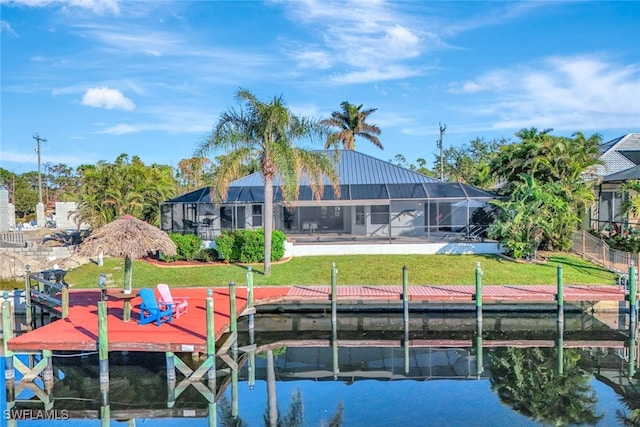 view of dock with a yard and glass enclosure