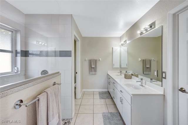 bathroom with vanity and tile patterned floors