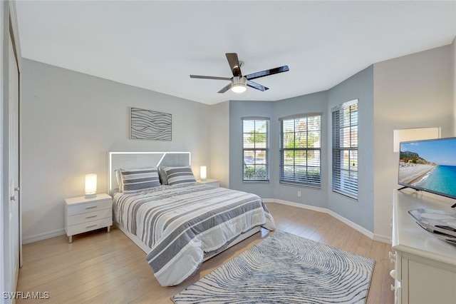 bedroom featuring ceiling fan and light hardwood / wood-style floors