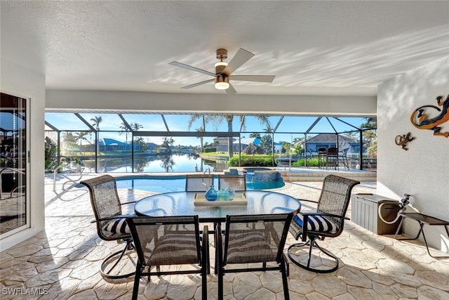 sunroom / solarium with a pool, a water view, and a healthy amount of sunlight