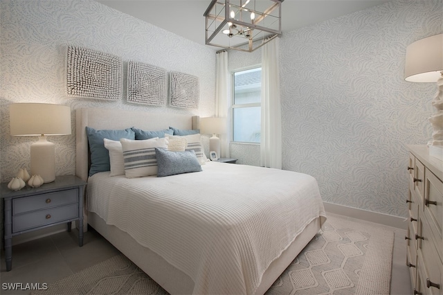 tiled bedroom featuring wallpapered walls and baseboards