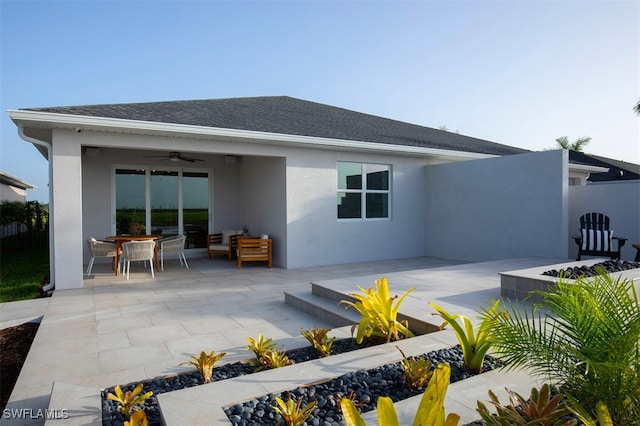 back of property featuring a ceiling fan, a patio area, fence, and stucco siding