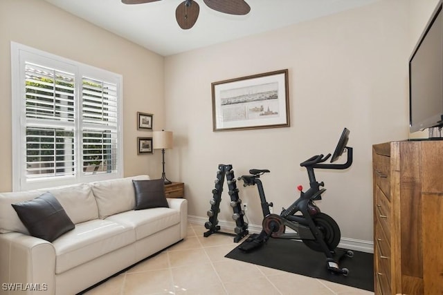 exercise area featuring ceiling fan and light tile patterned floors