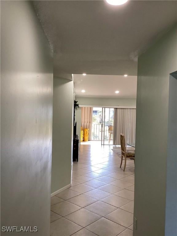 hallway featuring light tile patterned floors