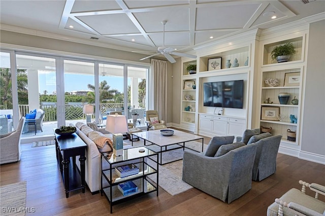 living room with ceiling fan, dark hardwood / wood-style flooring, coffered ceiling, and ornamental molding