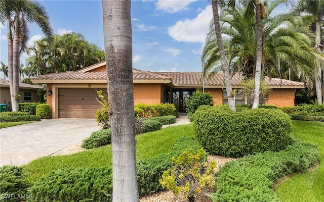 view of front of property with a garage