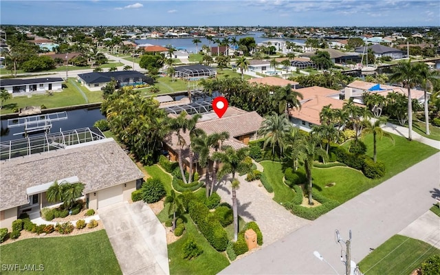 birds eye view of property with a water view