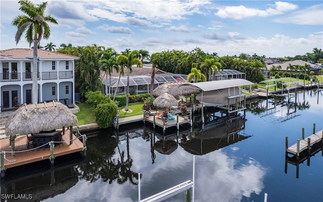 view of dock with a water view and a lanai