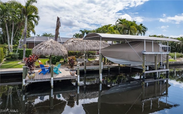 dock area featuring glass enclosure and a water view