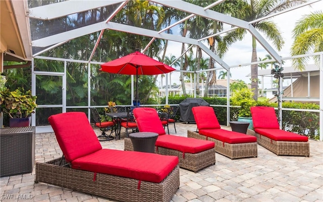 view of patio / terrace with a lanai and a grill