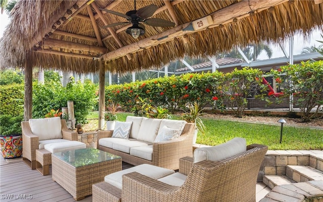 wooden deck with a gazebo and ceiling fan