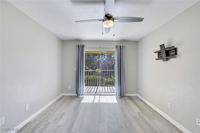 empty room with ceiling fan and light wood-type flooring