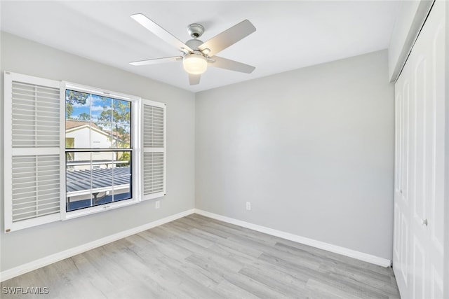 unfurnished room featuring ceiling fan and light wood-type flooring