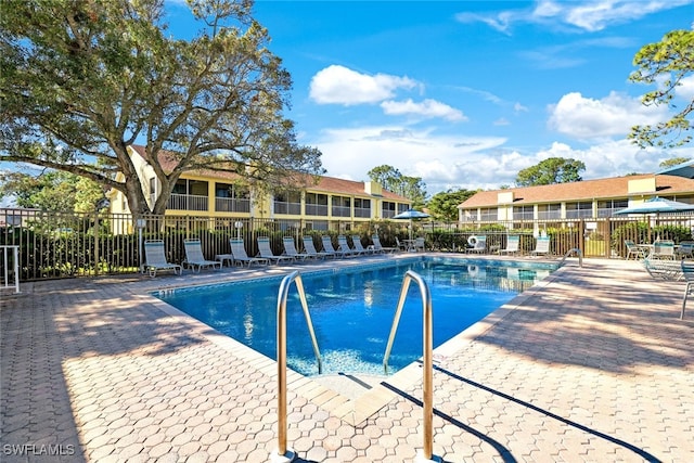 view of swimming pool featuring a patio