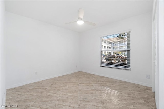 unfurnished room featuring ceiling fan