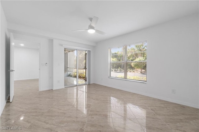 unfurnished room with ceiling fan