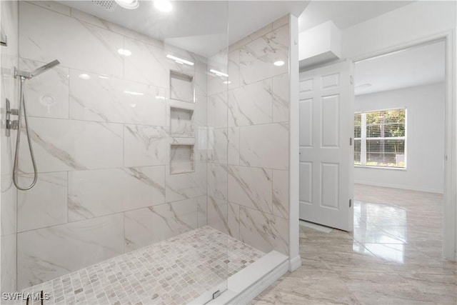 bathroom featuring tiled shower