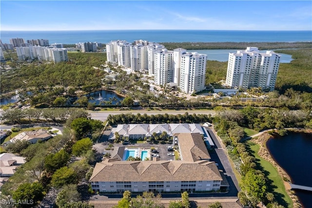 birds eye view of property with a water view