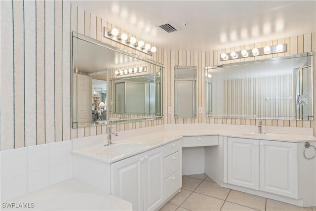 bathroom featuring tile patterned flooring and vanity