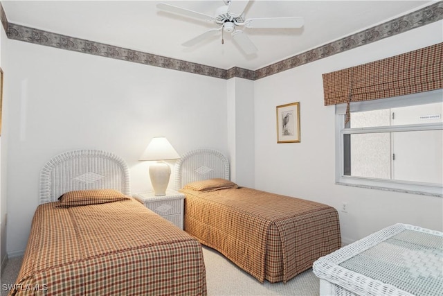 bedroom with ceiling fan and carpet floors