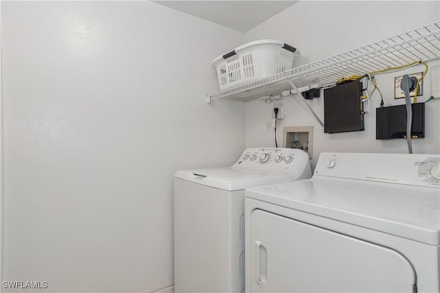 clothes washing area with independent washer and dryer