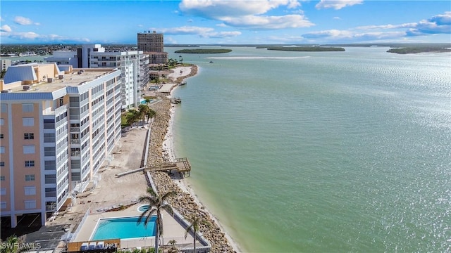 drone / aerial view featuring a view of the beach and a water view