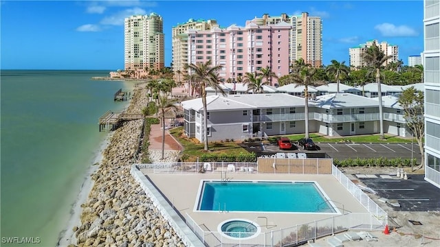 birds eye view of property featuring a water view