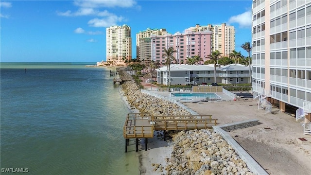 view of pool featuring a water view