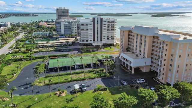 birds eye view of property with a water view