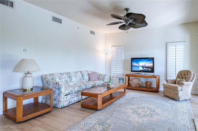 10041 Lake Cove Dr Unit 202, Fort Myers, FL 33908 - living area featuring wood finished floors and ceiling fan