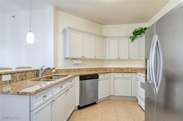 10041 Lake Cove Dr Unit 202, Fort Myers, FL 33908 - kitchen featuring stainless steel appliances, a sink, light stone counters, light tile patterned flooring, and hanging light fixtures