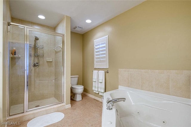 bathroom featuring shower with separate bathtub, toilet, and tile patterned floors