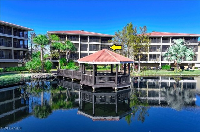 dock area featuring a gazebo and a water view