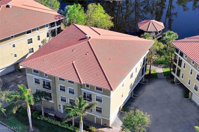 birds eye view of property with a water view