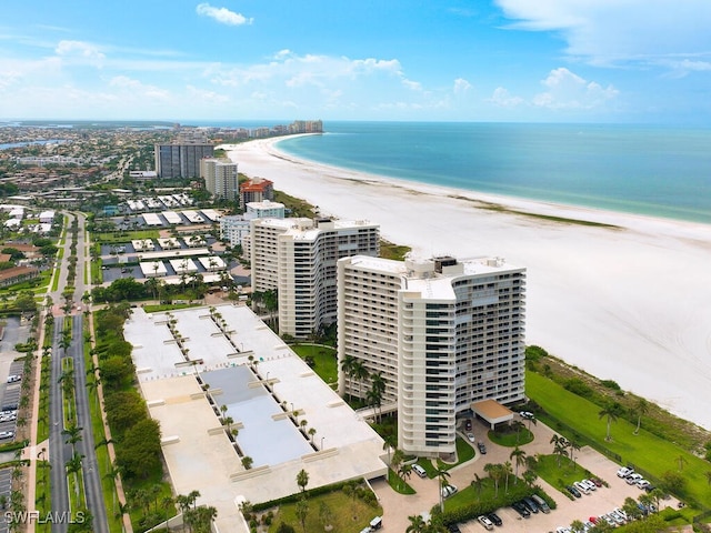 birds eye view of property with a view of the beach and a water view