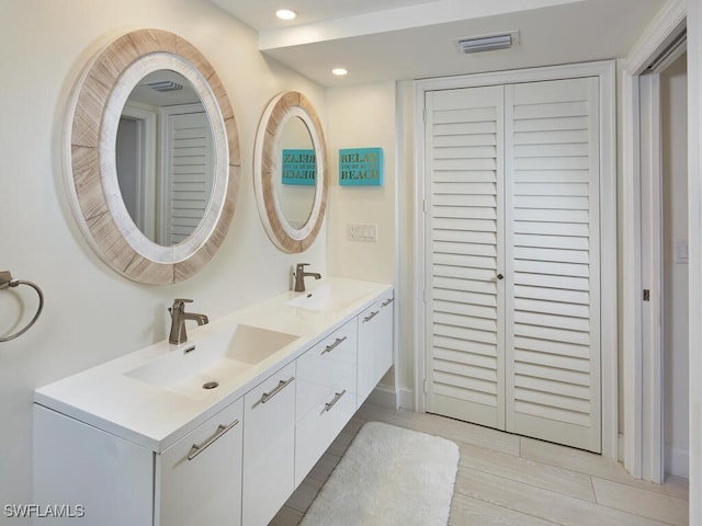 bathroom featuring vanity and wood-type flooring