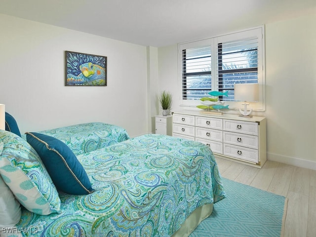 bedroom with light hardwood / wood-style flooring