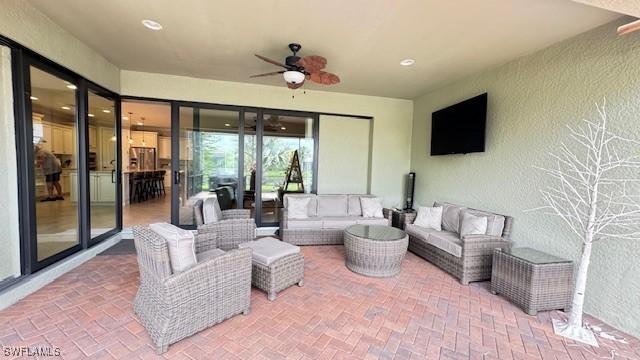 view of patio featuring outdoor lounge area and ceiling fan