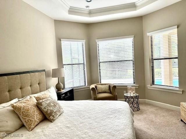 bedroom featuring light colored carpet, ornamental molding, and multiple windows