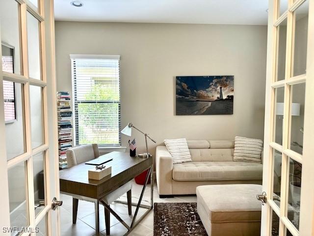 office area with tile patterned floors, french doors, and plenty of natural light