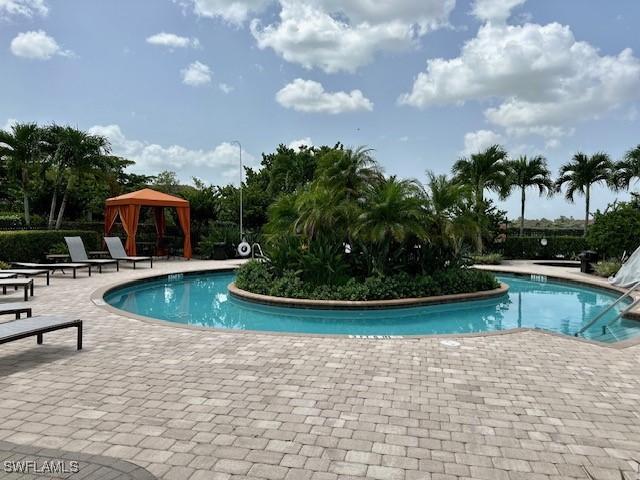 view of pool featuring a gazebo and a patio