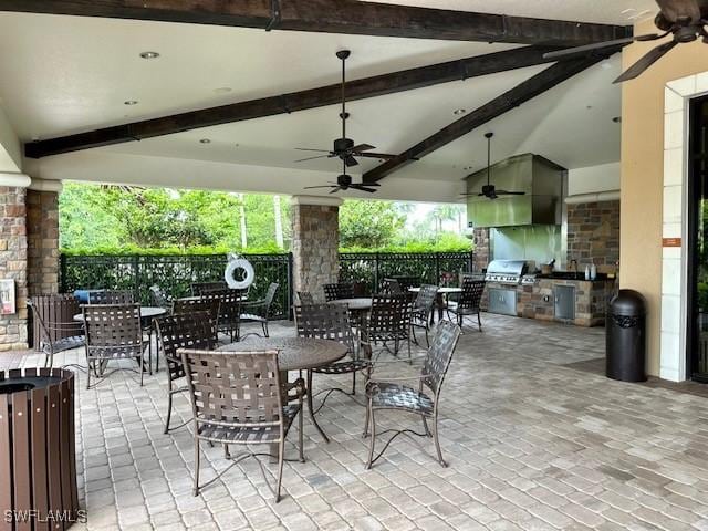 view of patio with area for grilling and ceiling fan