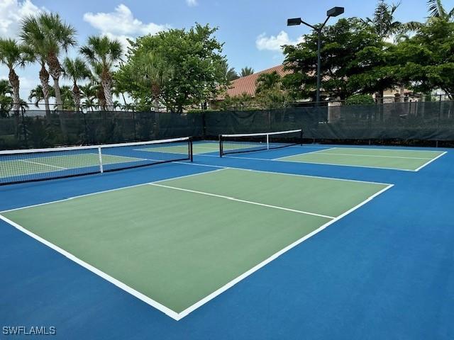 view of sport court featuring basketball hoop