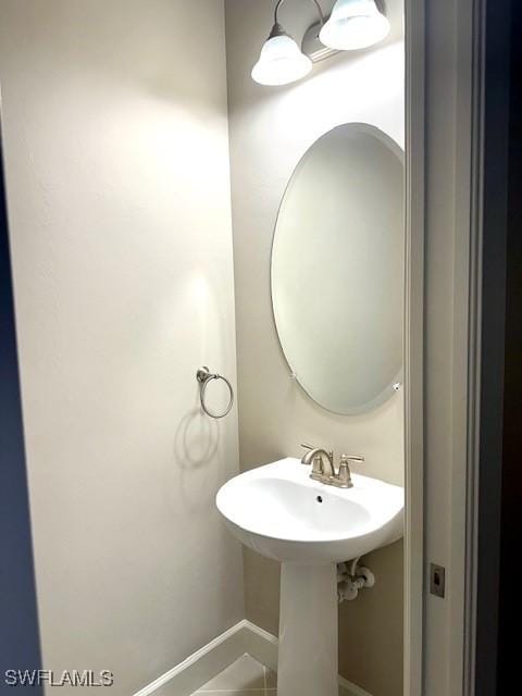 bathroom with tile patterned floors