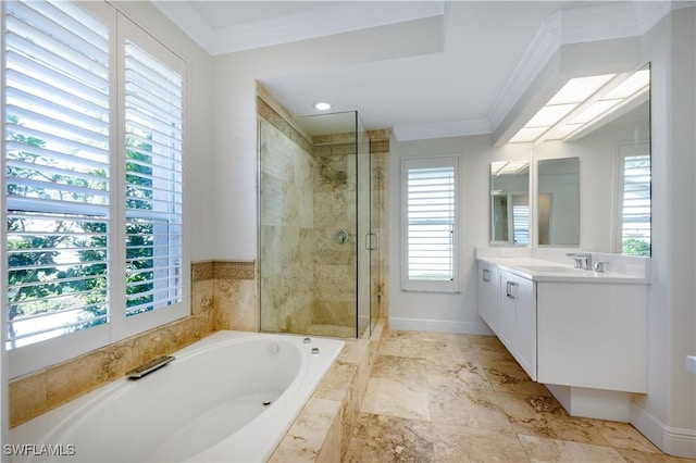 bathroom with plus walk in shower, vanity, and crown molding