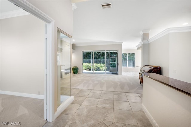 corridor featuring crown molding and light colored carpet